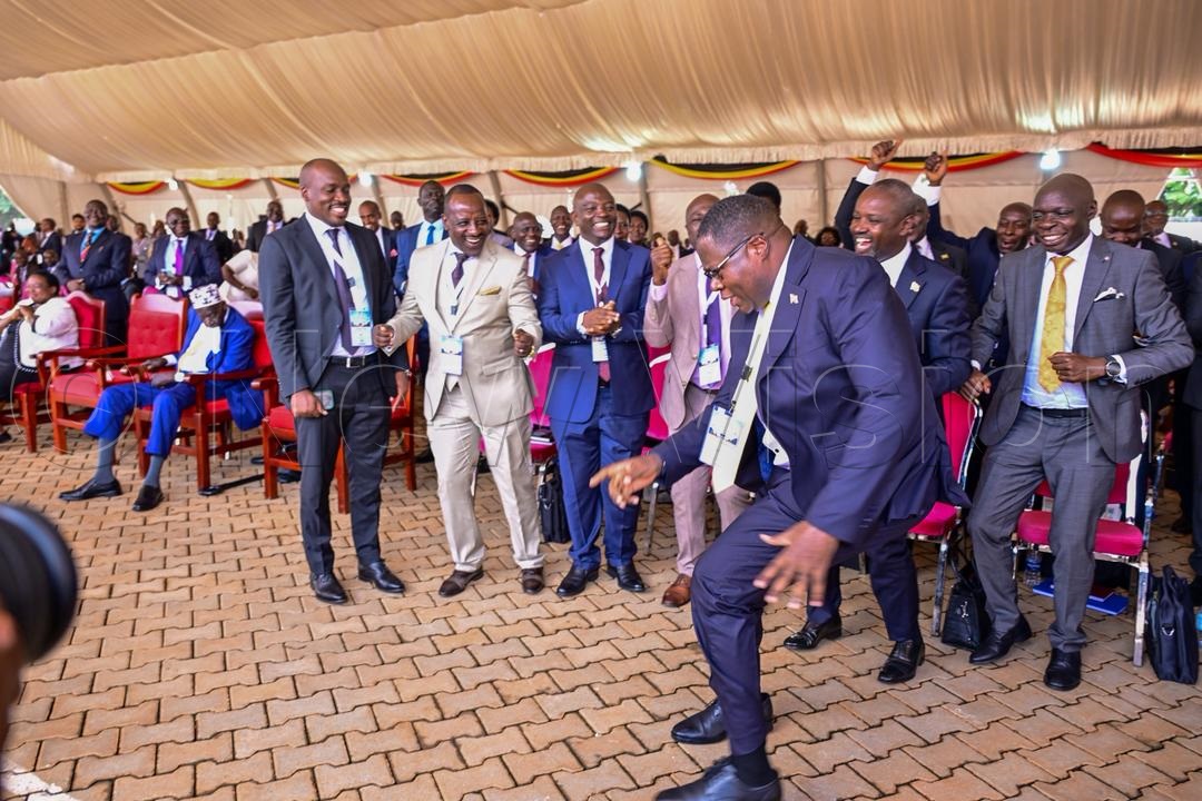 Oboth-Oboth celebrating with other legislators. (Credit: Miriam Namutebi)