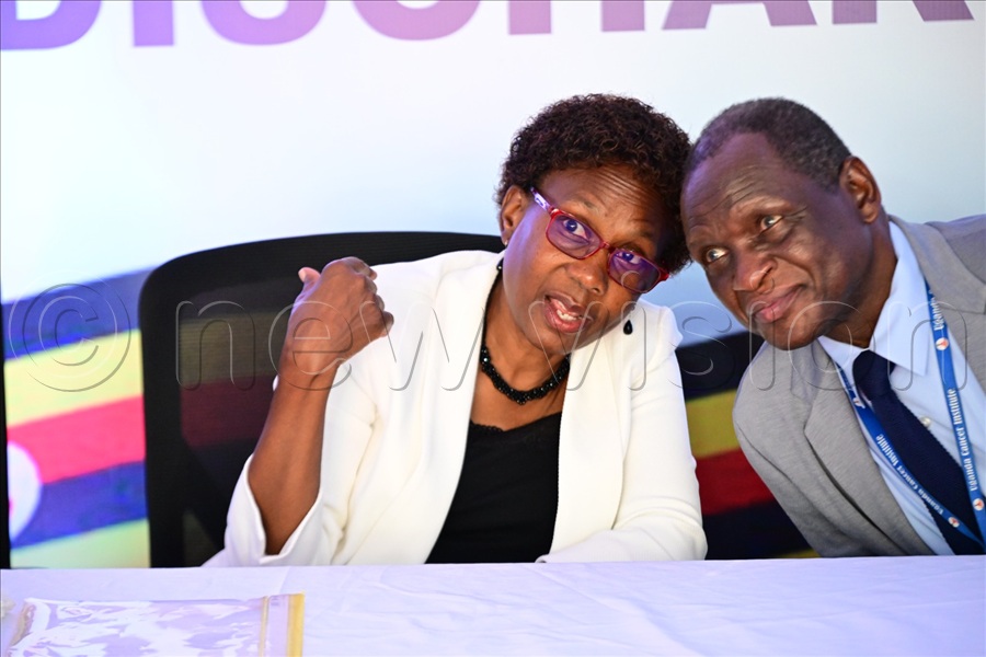 Health minister Jane Ruth Aceng interacts with Uganda Cancer Institute ED Dr. Jackson Orem. (All Photos by Maria Wamala)