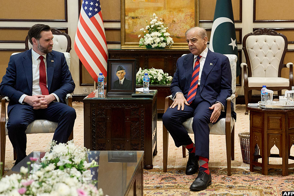US Vice President JD Vance (L) speaks with Pakistani Prime Minister Shehbaz Sharif ahead of their meeting on Iran amid the US-Iran peace talks in Islamabad on April 11, 2026