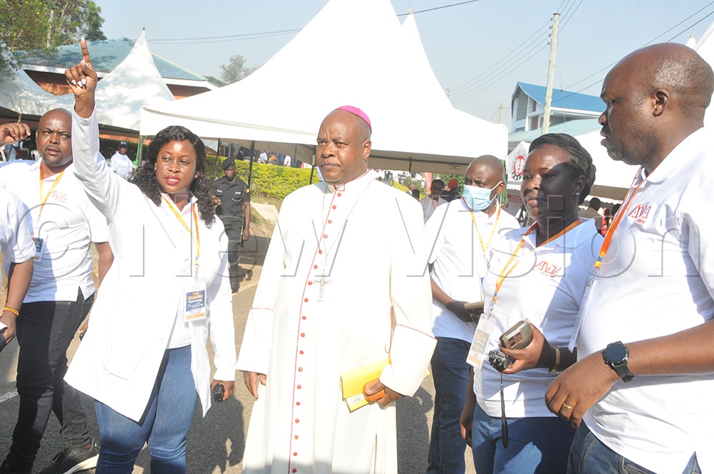 The Mbarara Archdiocese Archbishop, His Grace Lambert Bainomugisha, being taken through at the AMDA Caravan medical camp which attracted people of all ages at Maryhill High School in Mbarara City. (Credit: Abdulkarim Ssengendo)