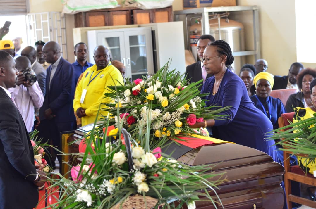 Luwero triangle Minister Alice Kaboyo laying a wreath on Bwabye s casket.