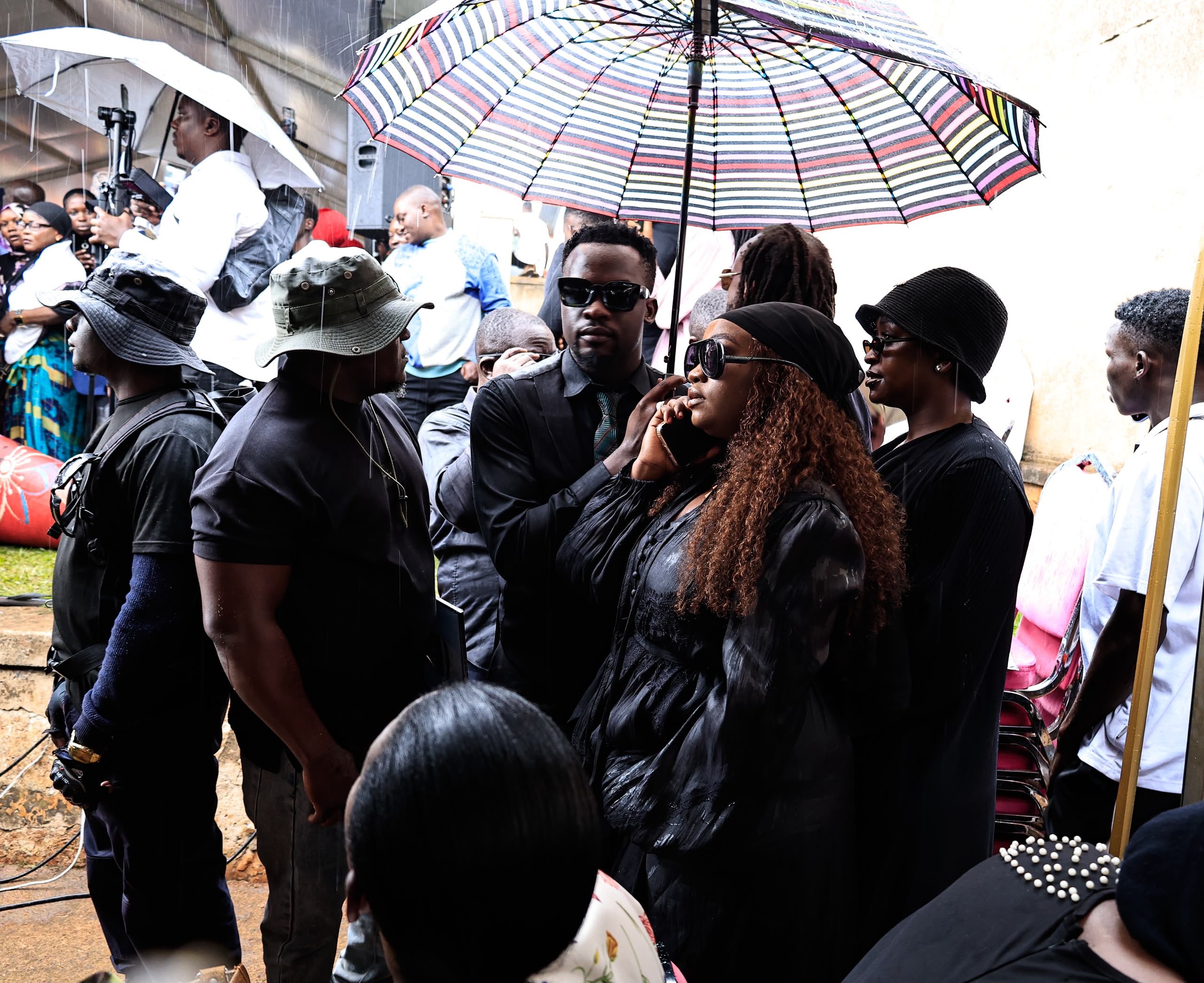 Singer Carol Nantongo and husband Dylan braved the afternoon downpour to send off Matovu. Photo Ignatius Kamya