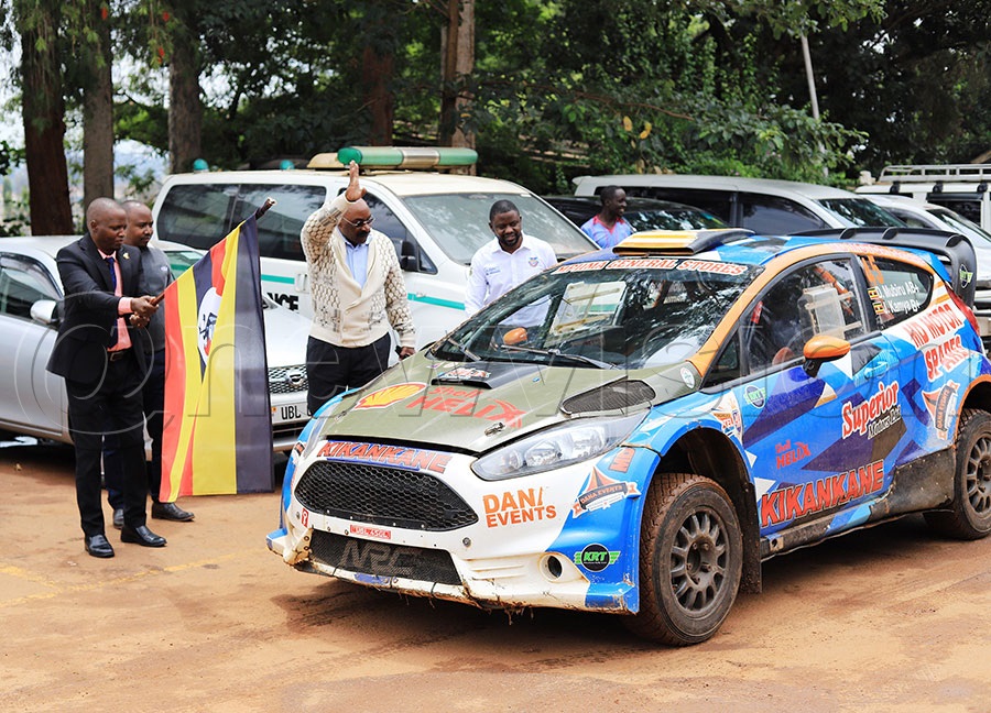 The Assistant General Secretary National Council of Sports Milton Chebet flags off Duncan 'Kikankane' Mubiru at Lugogo to the WRC Safari Rally due in Naivasha Kenya. PHOTO: Johnson Were