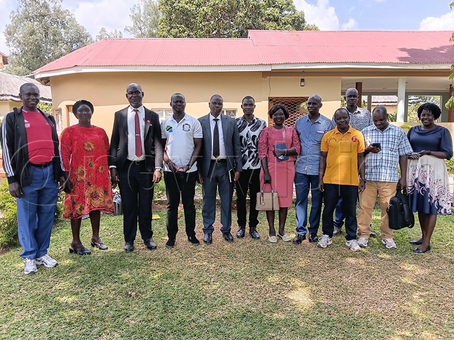The new and old excutive team taking a group photo after the handover ceremony in Soroti