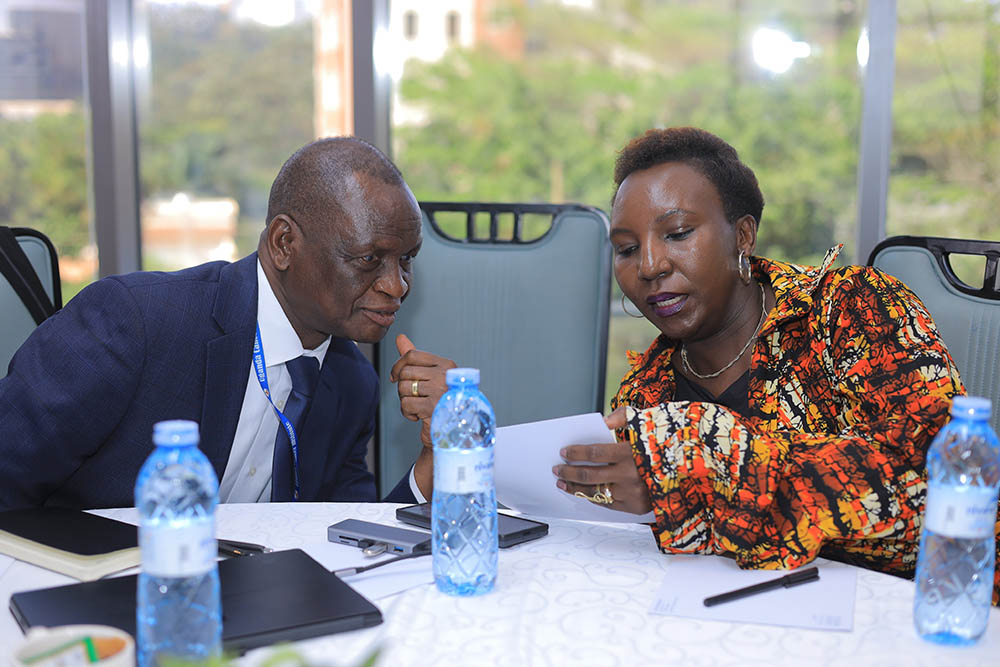 UCI executive director Dr Jackson Orem (L) said the workshop served as a critical step in outlining preparatory actions towards developing a pioneering health financing mechanism leveraging diaspora remittances and blended-finance guarantees to strengthen Uganda’s health system.