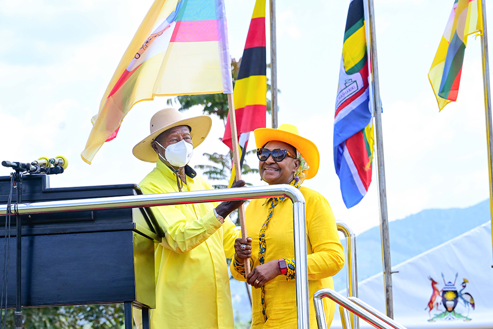 President Museveni hands over the party flag to Mrs Jacqueline Mbabazi during a campaign rally at Rwere play grounds in Kinkinzi East in Kanungu district on Wednesday, Nov. 26, 2025. (PPU)