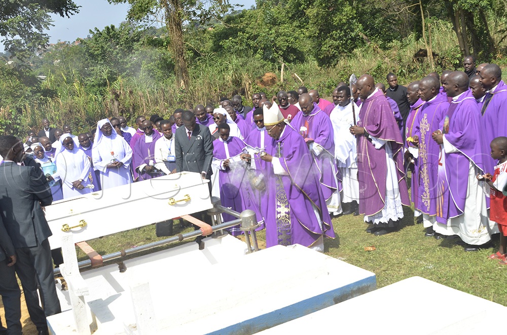 Archbishop Augustine Kasujja, the Emeritus Papal Nuncio to Belgium, incenses the grave of the late centenarian Catholic nun Angelica Nabakooza. She was a member of the Immaculate Heart of Mary Reparatrix - Ggogonya congregation. The ceremony took place at Ggogonya Sisters’ Cemetery, located in Kisubi off Entebbe Road, Katabi County, Wakiso District, on Wednesday, July 29, 2026. (Photo by Juliet Anna Lukwago)