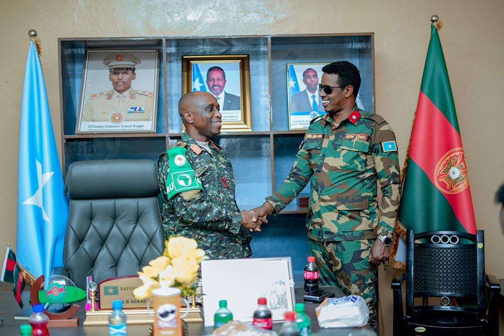 UPDF Battle Group XLV Commander, Col Justus Musenene and Gare. (Courtesy)