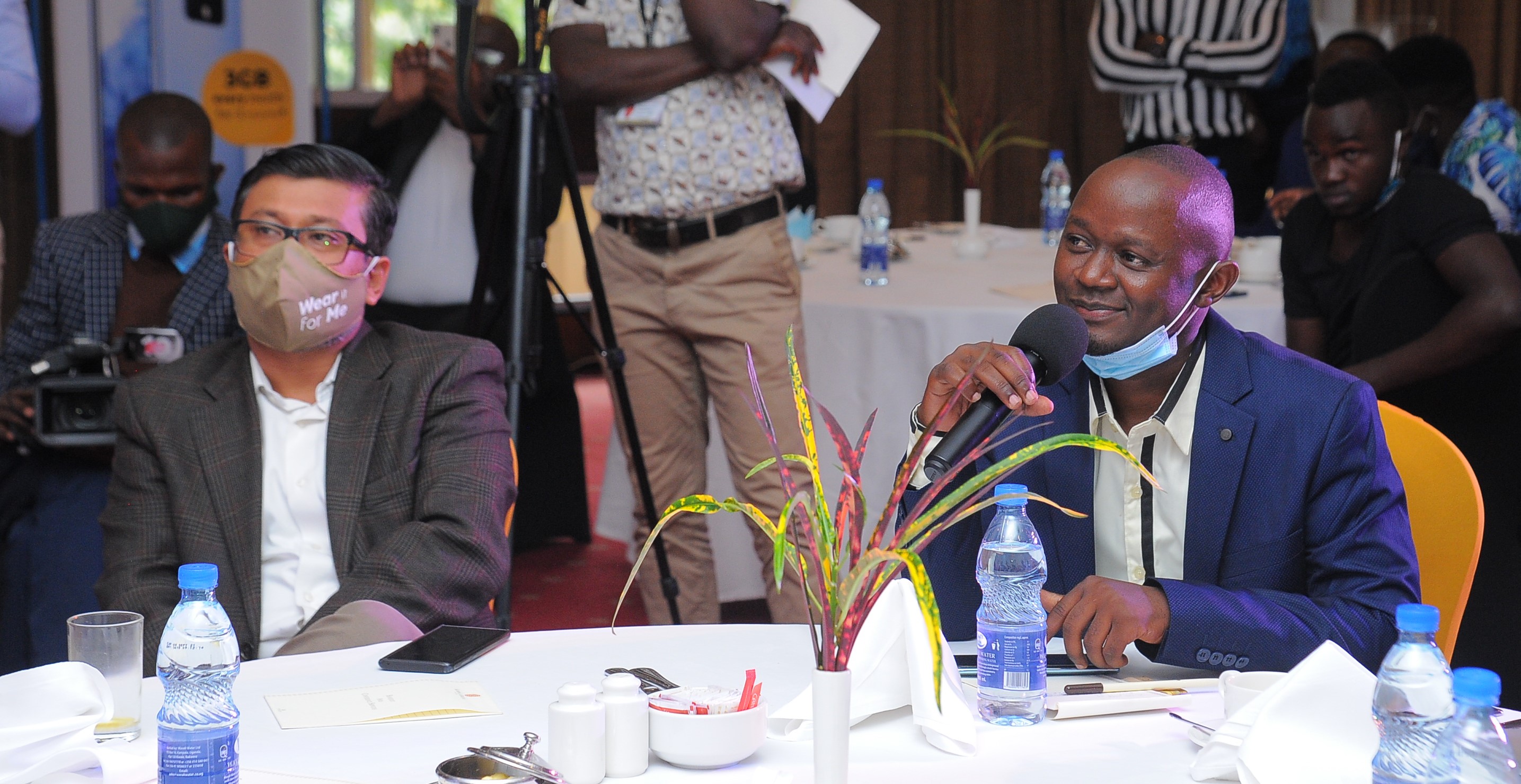 MTN Uganda CMO Somdev Sen (left) with Tecno's Steven Ssemyalo (right) at the Camon 16 Launch in Kampala on Wednesday