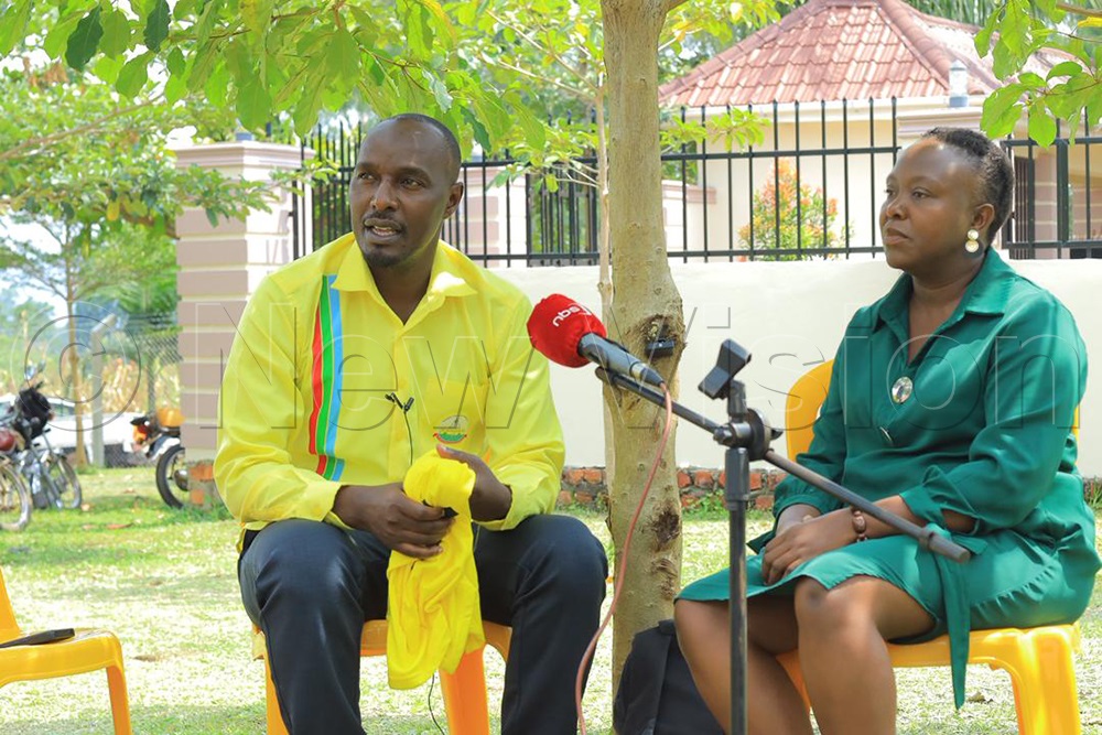 Western region National NRM vice chairman Engineer Jonard Asiimwe (left) welcoming NUP's Bern Kalisa Kunihira, who crossed to NRM. (Photo by Peter Abaanabasazi)