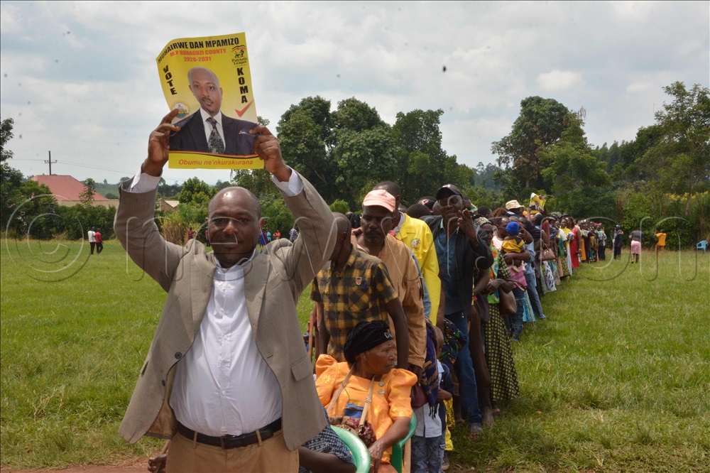 Dan Muhairwe carrying his poster.