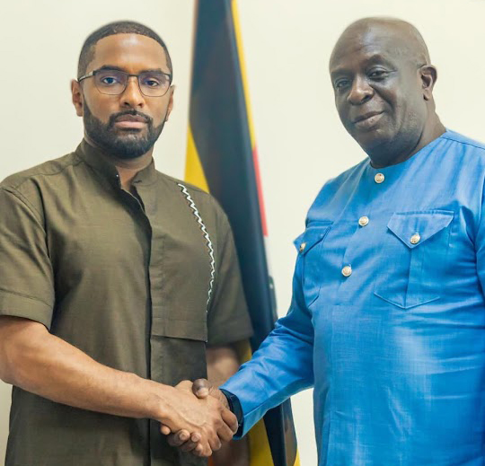 US investor Peter Brooks shaking hands with the senior presidential advisor on diaspora affairs, Amb. Abbey Walusimbi. (Courtesy)