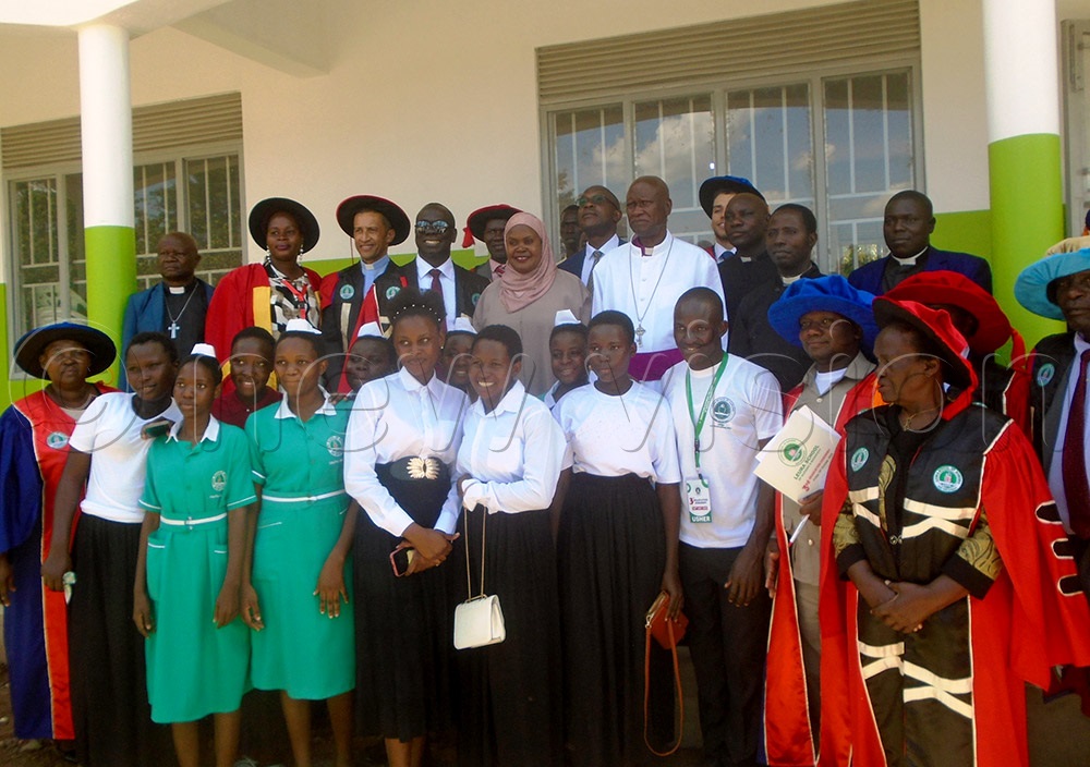 Third Deputy Prime Minister Rukia Isanga Nakadama (middle) poses for a photo with other guests, staff and students of Leura School of Nursing and Midwifery graduation. (Photo by Charles Kakamwa)