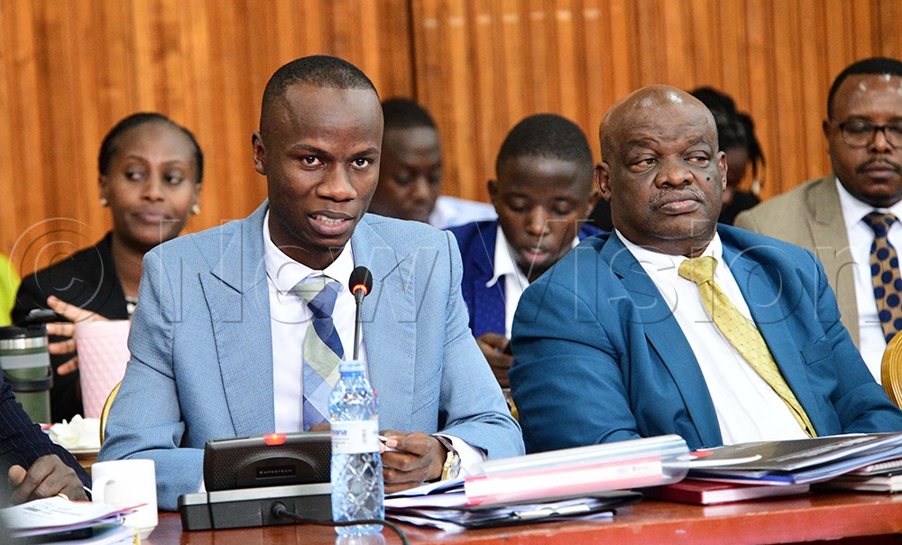 Karim Masaba, the Member of Parliament for the Mbale Industrial City Division in Mbale City and Moses Goli Ogwal MP Dokolo North County during the finace committee of parliament on April 15, 2026. (Photo by Maria Wamala)
