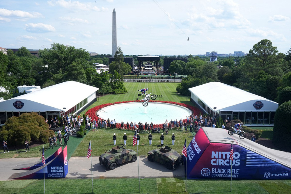 A stunt performer does a motorcycle jump, ahead of Sunday's UFC Freedom 250 fights on the South Lawn of the White House in Washington, DC, on June 13, 2026. (Photo by Mark Schiefelbein / POOL / AFP)
