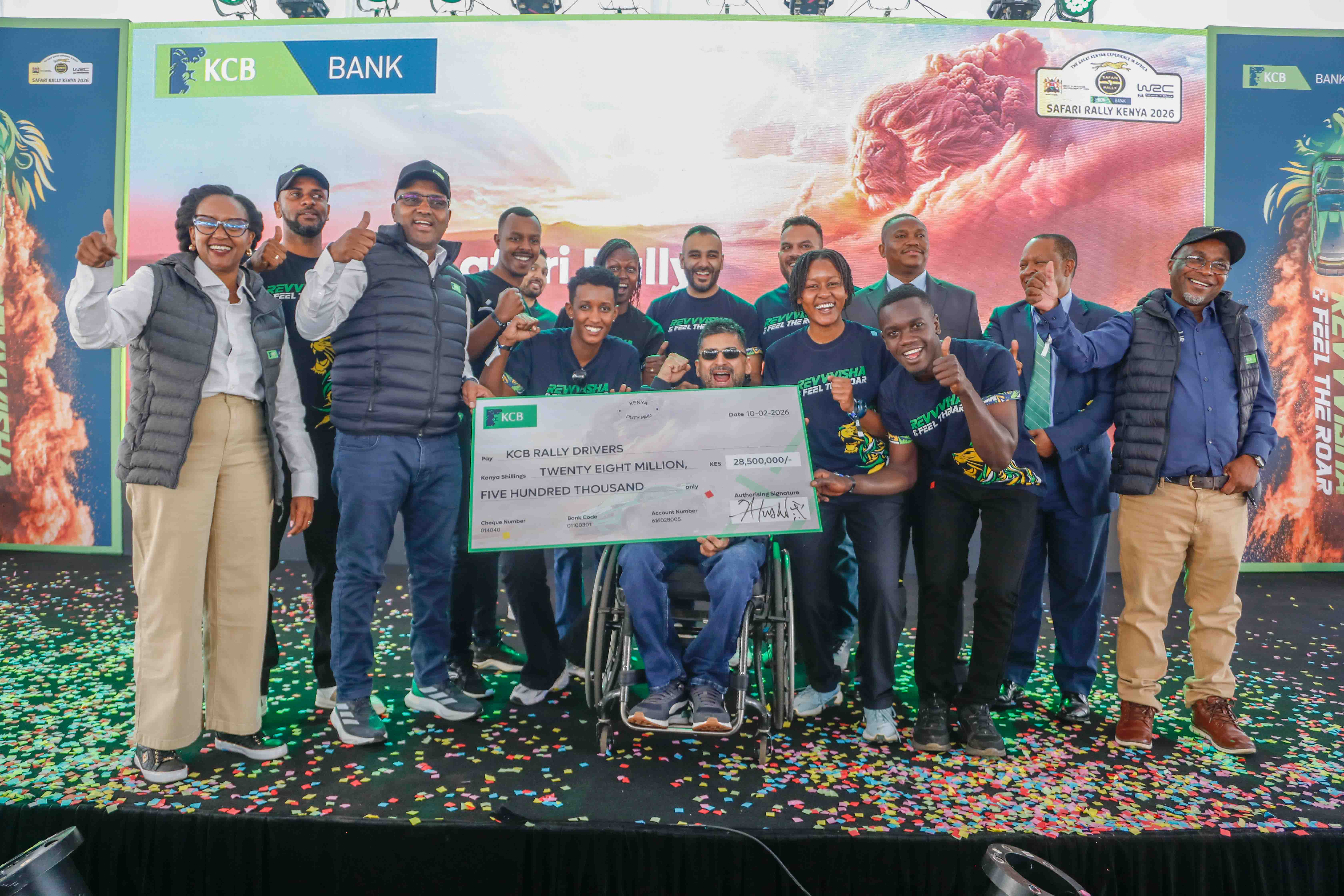 KCB Group CEO Paul Russo and PS State Department of  Sports, Elijah Mwangi, present a cheque to the KCB-sponsored rally drivers from across East Africa during the official launch of the 2026 KCB WRC Safari Rally Sponsorship at KICC, Nairobi