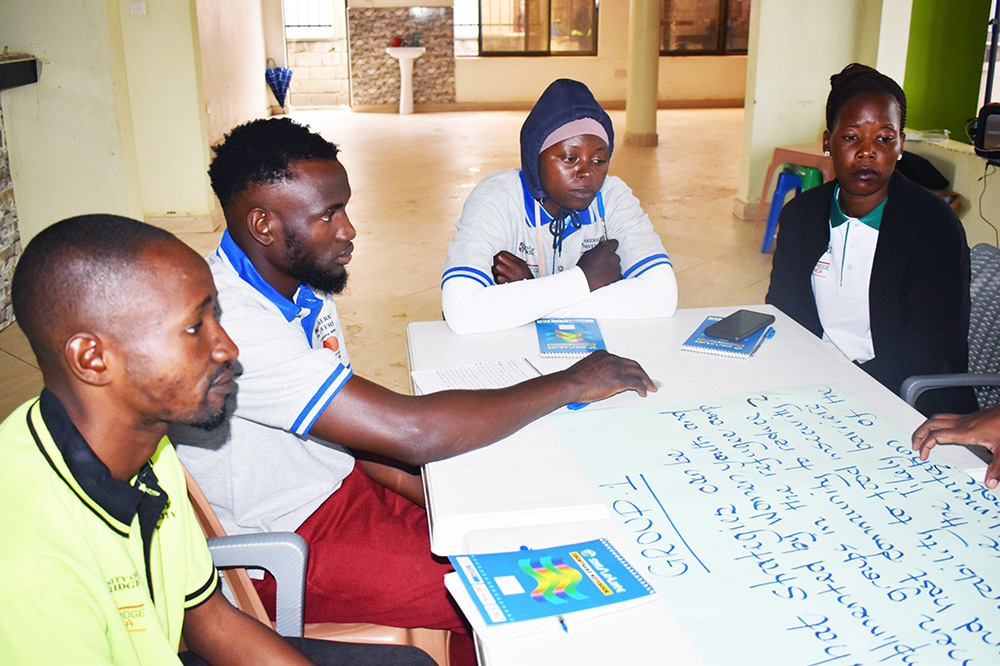 Refugees and communities living around Kasese district discuss the problems brought about by the flooding of River Nyamwamba at Farmers Lounge, Kikuube District. (Courtesy photo)