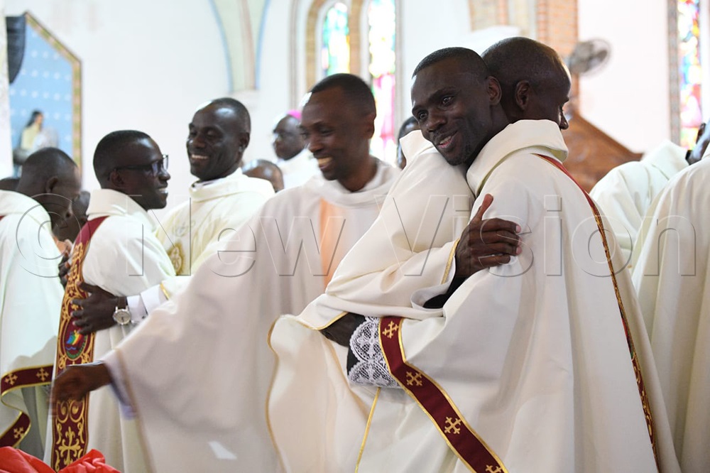 Priests are dressing up and congratulating the newly ordained priests.