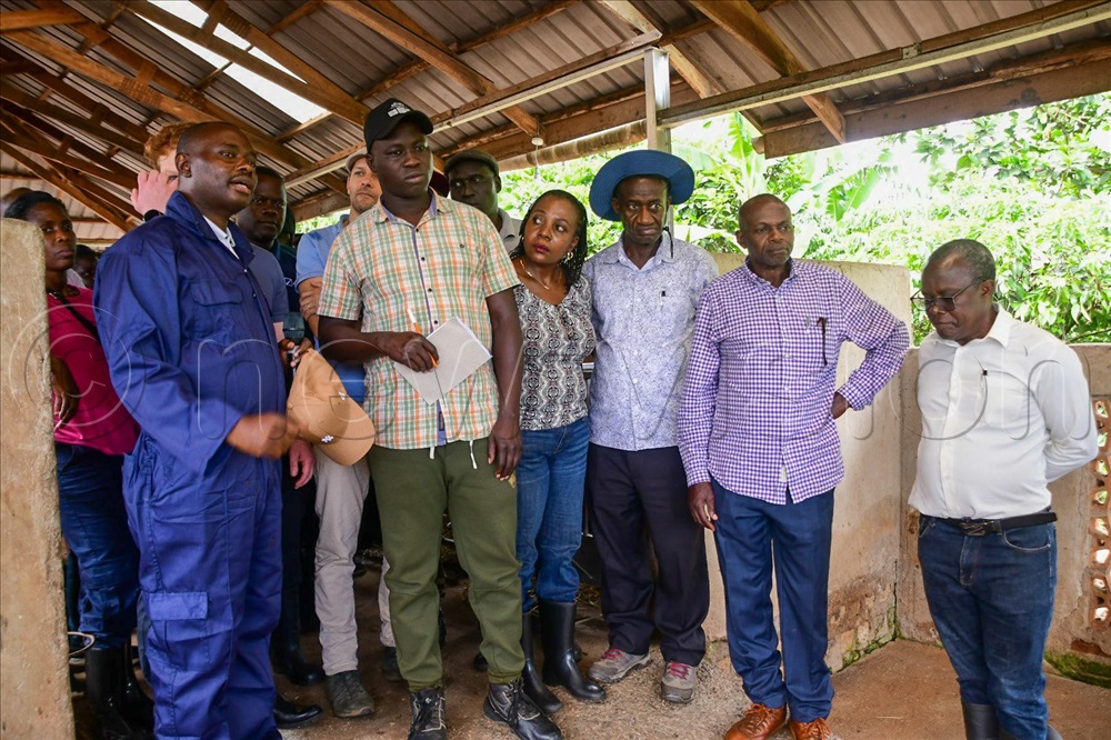 Rutah Ngabwa (left) guiding guests around the farm.