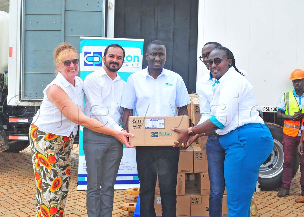 (L-R) Philippa Forsyth Board member Piston handing over the first medical supply to Prashant Dave from Shreeji Pharmaceutical with Yazidi Ndhote the commercial head Piston, Benjamin Kizza the chief Executive officer Piston and Olive Ainebyona, the managing Director Piston Medical Limited during the flagging off the first shipment of its medical products at their facility in Namanve Industrial Park on September 2025. (Credit: Nicholas Oneal) 