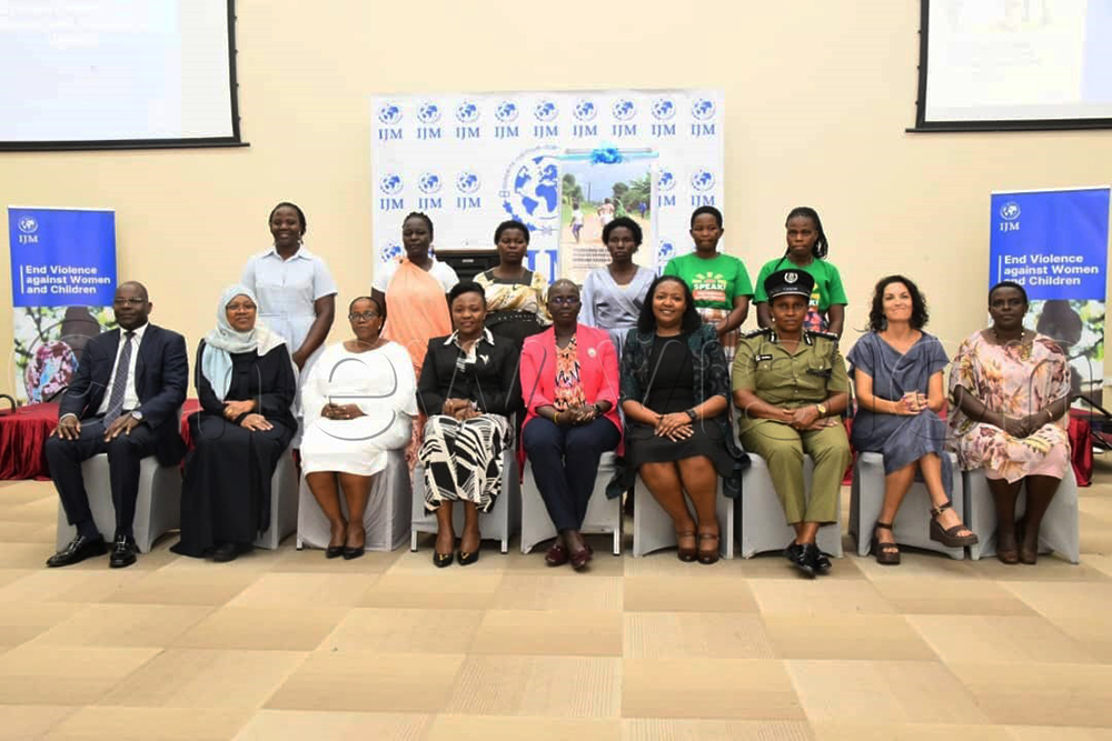 The chief guest, Lady Justice Jane Frances Abodo poses for a photo with other stakeholders during the launch of the International Justice Mission (IJM) Uganda Violence Against Women and Children (VAWC) National Baseline Report. (Photo by Mpalanyi Ssentongo)