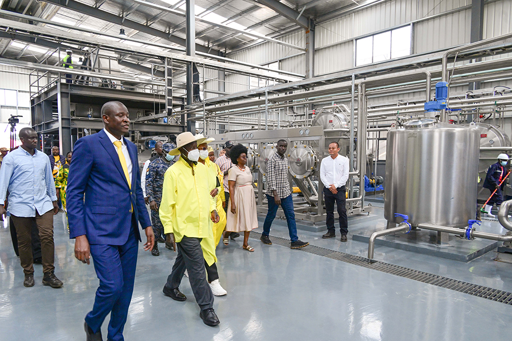  Dr Mathias Magoola (L), the founder of Dei BioPharma, taking President Museveni and First Lady Janet Museveni on a guided tour of the starch manufacturing plant at Namasagali in Kamuli district.