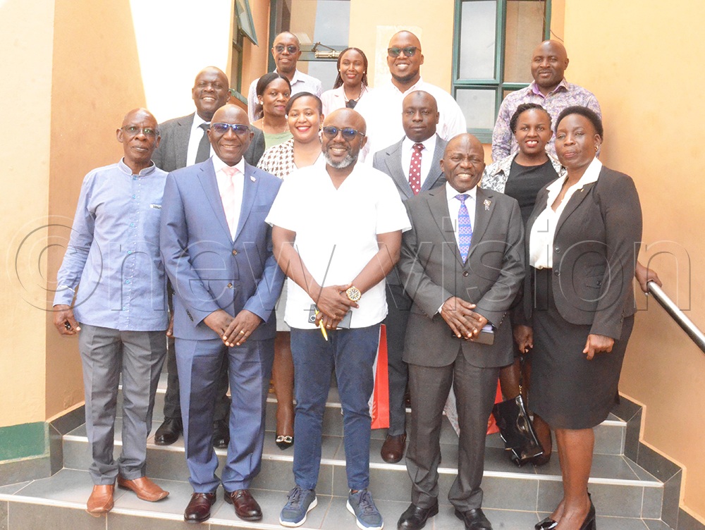 Front row: Vision Group Chief Executive Officer Don Wanyama (centre), Rotary Cancer Run Executive Director Nelson Kabwami (left), Rotary District 9214 Governor Daniel Mukasa Ddamulira (second left), Rotary Cancer Run Board Chairperson Stephen Mwanje (second right) and other Rotarians pose for a group photo during a meeting at Vision Group’s head offices in Kampala. (Photo by Isaac Nuwagaba).