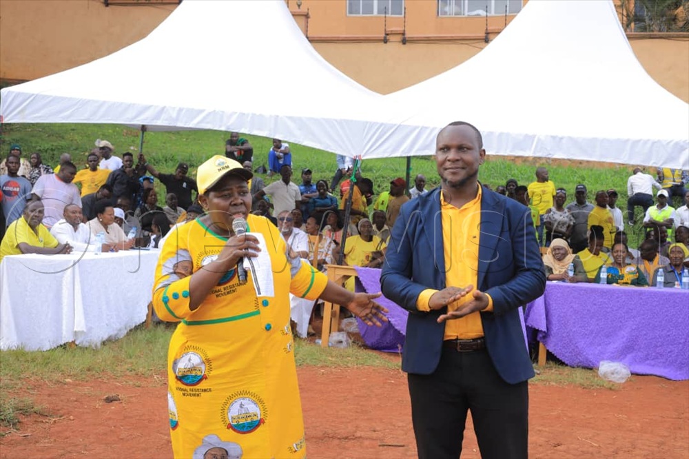 Rose Namayanja the NRN Deputy Secretary General interacting with Maureen Tumusiime NRM Vice Chairperson Woman League Kampala during a meeting at Nakasero Primary school. (Photo by Jeff Andrew Lule)