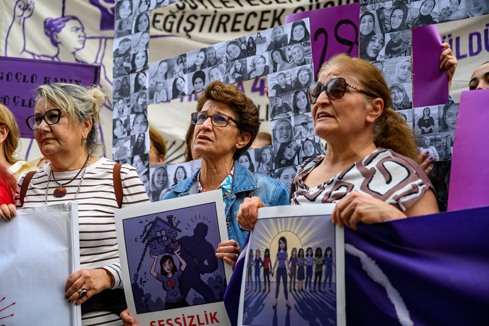 Protesters hold placards and shout slogans during a protest ahead of the International Day for the Elimination of Violence Against Women, in Istanbul, on November 23, 2025. (AFP)