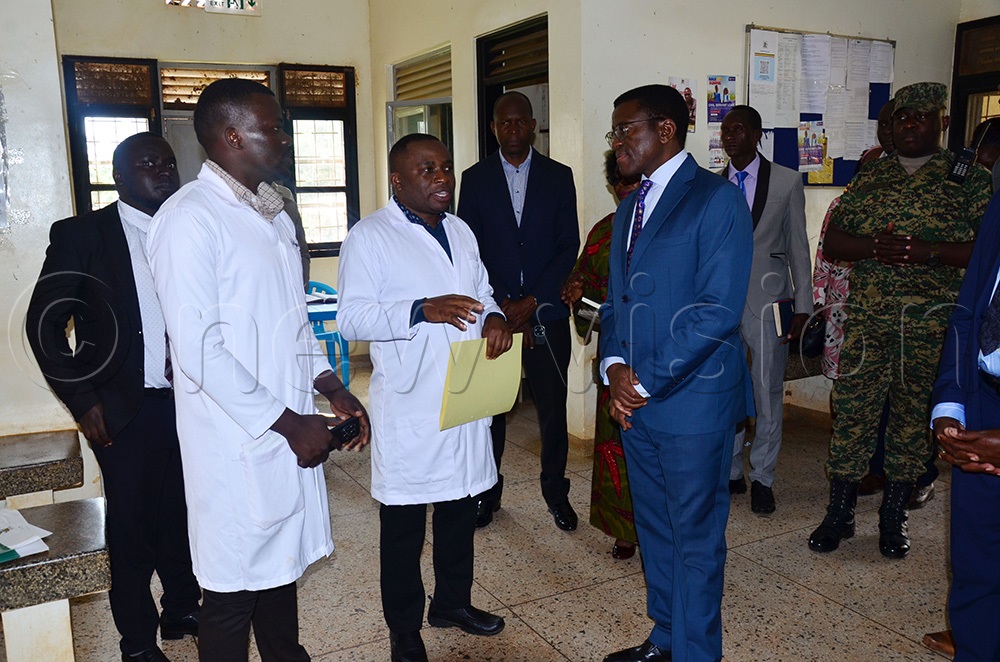 The in charge Buvuuma Health Center IV in Buvuuma district Dr Remmy Ndyanabo talking to the Katikkiro of Buganda Charles Peter Mayinga during the facility tour. (Photo by Agnes Kyotalengerire)
