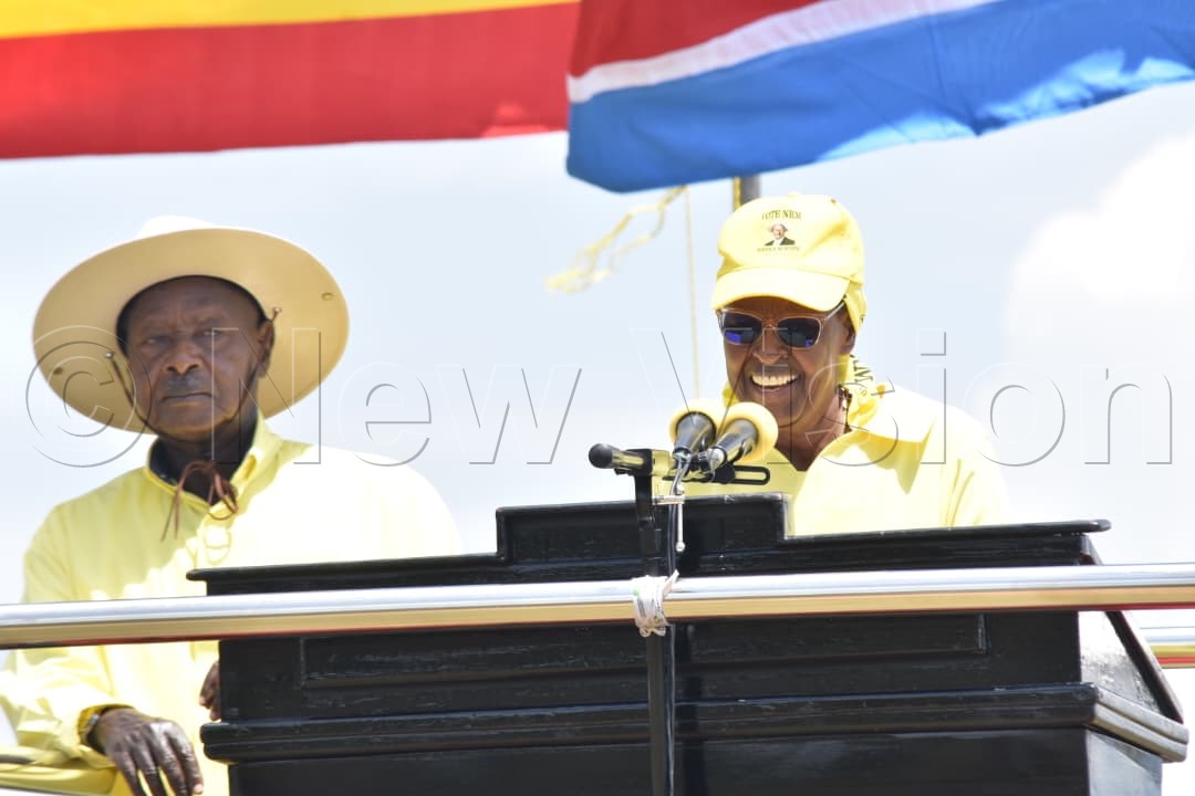 First Lady and minister of Education and Sports, Mamma Janet Museveni speaking as President Museveni looks on. (Credit: Simon Peter Tumwine)