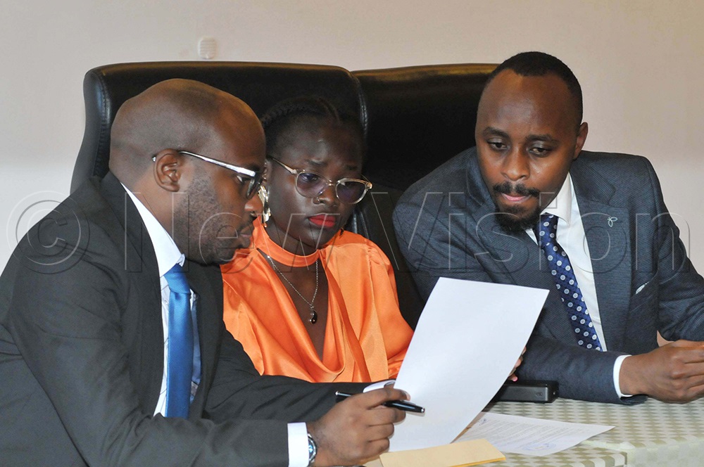 B(L-R) Andrew Karamagi, Grace Achilla, and Kato Tumusiime, who represented a team of lawyers addressing the media on a petition regarding a breach of the Leadership Code, on Wednesday, May 13, 2026. (Photo by Nicholas Oneal)