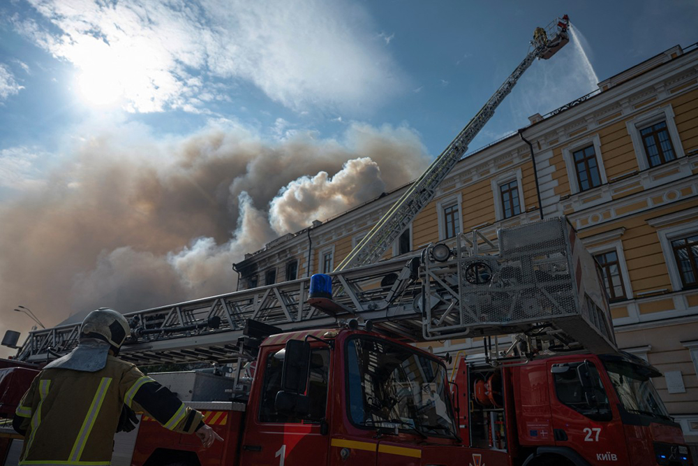 Firefighters tackle a blaze engulfing a building of the Ukrainian Academy of Science which was hit by a Russian drone in the centre of Kyiv on September 28, 2026, amid the Russian invasion of Ukraine. 