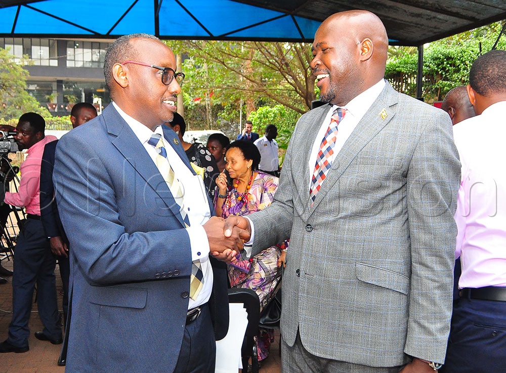 Stephen Asiimwe, Executive Director, Private Sector Foundation Uganda (PSFU) interacting with the High Commissioner of Uganda to South Africa, Paul Amoru during the press briefing held at Uganda Media Centre on Tuesday, February 7, 2023.