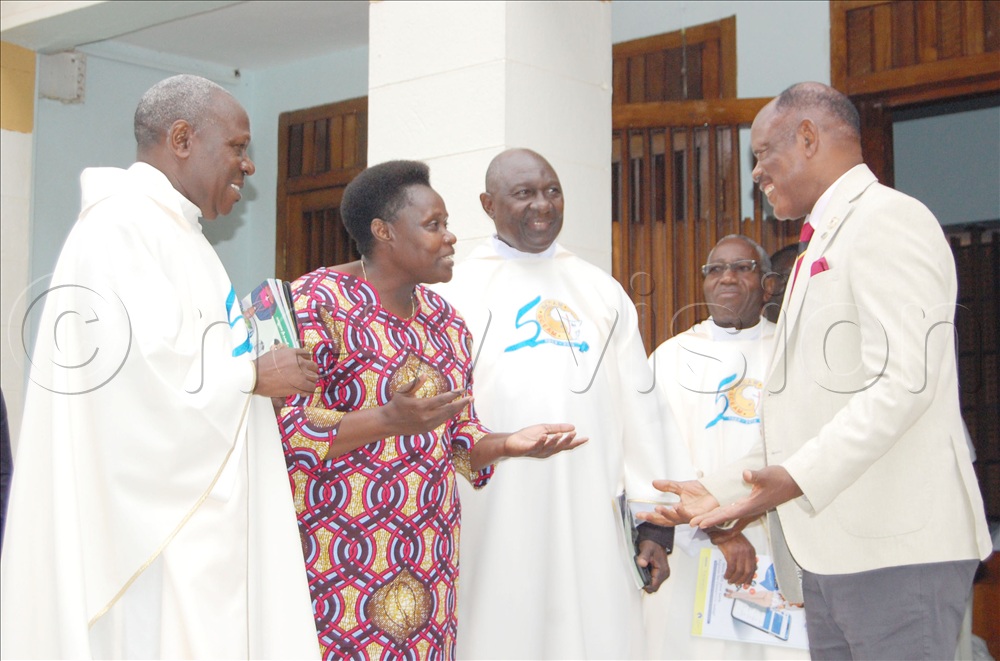 Vice-President Jessica Alupo (second-left) shares a moment with Fr. Josephat Ddungu (left), Msgr. Lawrence Ssemusu (third-left), Fr. Pontian Kaweesa (fourth-left) and Prof. Barnabas Nawangwe. This was during the celebration of the 85th anniversary of St Augustine Chapel, Makerere University on Sunday, April 12, 2026. 