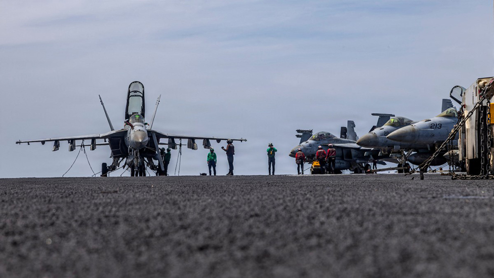 This US Navy handout photo released on May 4, 2026, by US Central Command Public Affairs shows US sailors conducting maintenance on the flight deck of the Nimitz-class aircraft carrier USS Abraham Lincoln (CVN 72) at sea on April 15, 2026. (Photo by US NAVY / AFP)