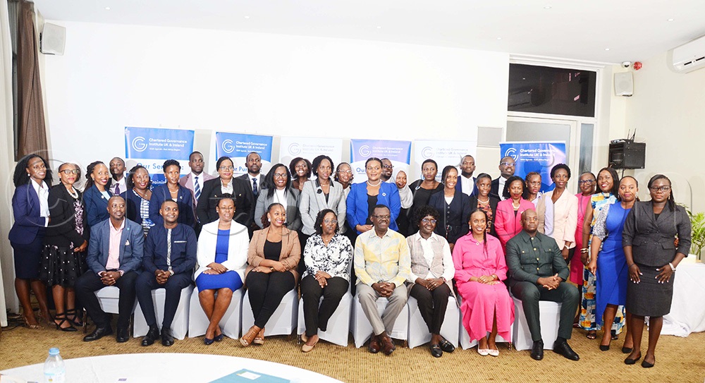 (Front Row) Managing Director NSSF Patrick Ayota (fourth right) and Jane Okot p'Bitek Langoya, the Chairperson ICSA Uganda (middle) in a group picture with ICSA graduates at Protea Skyz. (Photo by Isaac Nuwagaba)