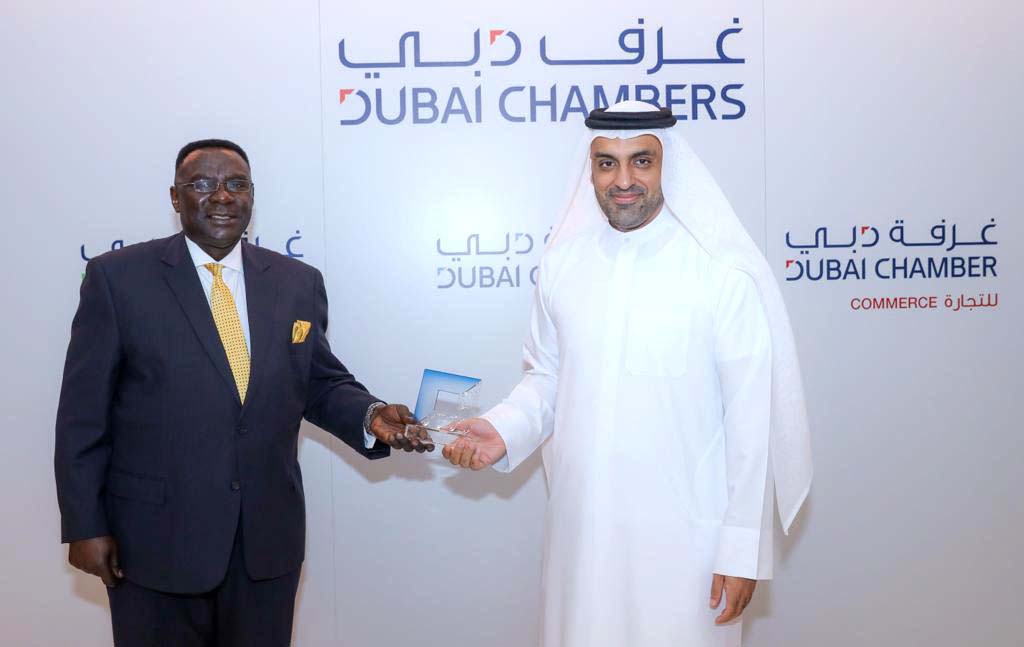 (Left) Henry Mayega, Ambassador of Uganda's Consulate General in Dubai, receives a gift from Mohammad Lootah, Chairman and Chief Executive Officer (CEO) of Dubai Chamber of Commerce (DCC) after a meeting at the Dubai Chamber's (DCC) Dubai headquarters