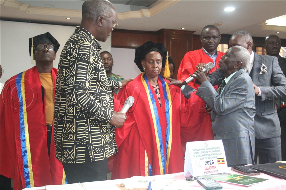 Reverend Elios Bizimenyera of Gospel Church Kazo being prayed for by the born-again elders after installation as the first president of CCA, Uganda.