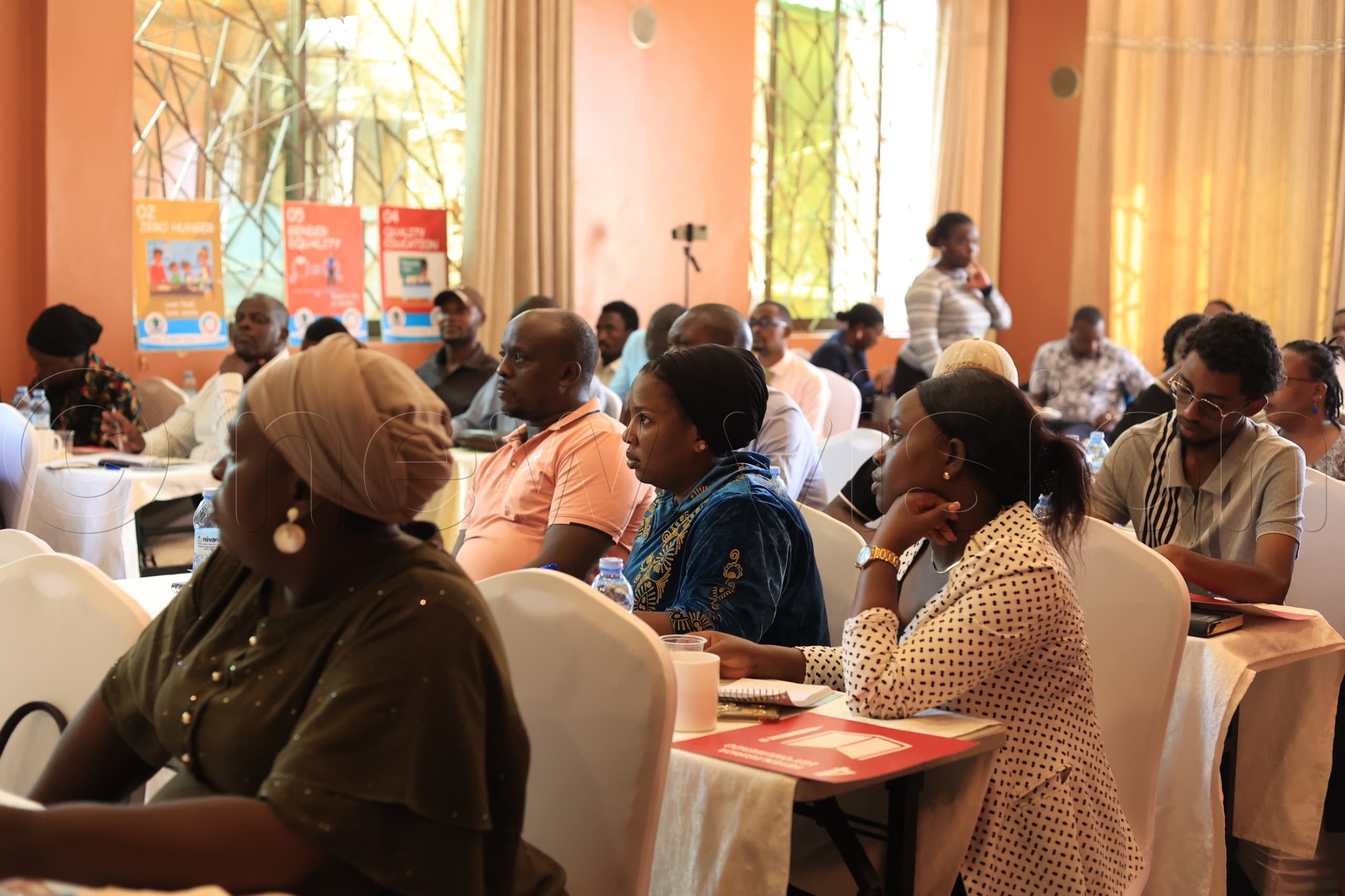 Local leaders from Kampala listen attentively during a training session.(Photo by John Masaba)