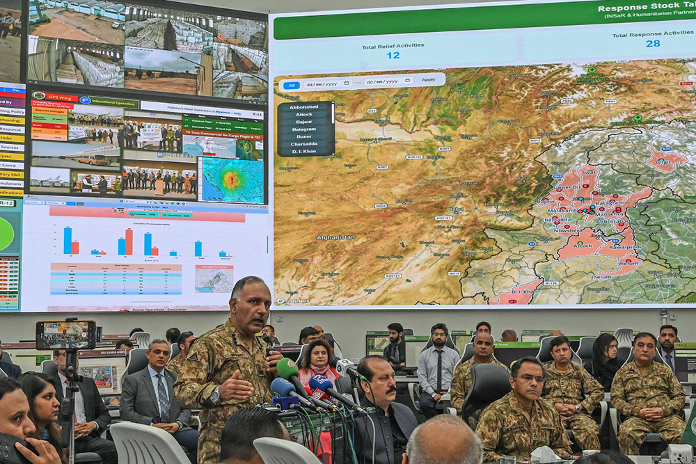 Chairman of the National Disaster Management Authority (NDMA), Lieutenant General Inam Haider (3L), speaks during a media briefing on the ongoing monsoon-related climate disaster in Islamabad on August 17, 2025. (Photo by Aamir QURESHI / AFP)