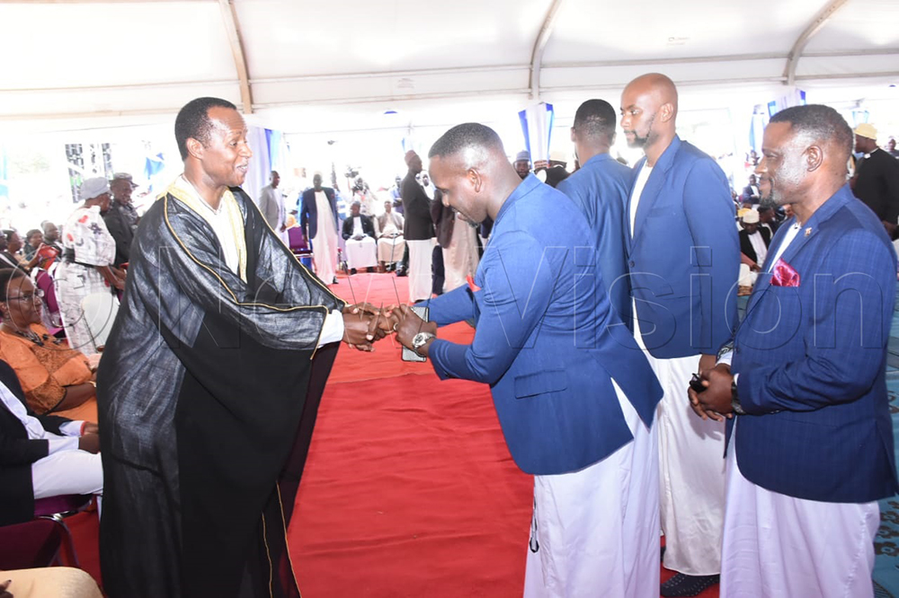 Leader of Opposition in Parliament, Joel Ssenyonyi greeting Prince David Kintu Wasajja.
