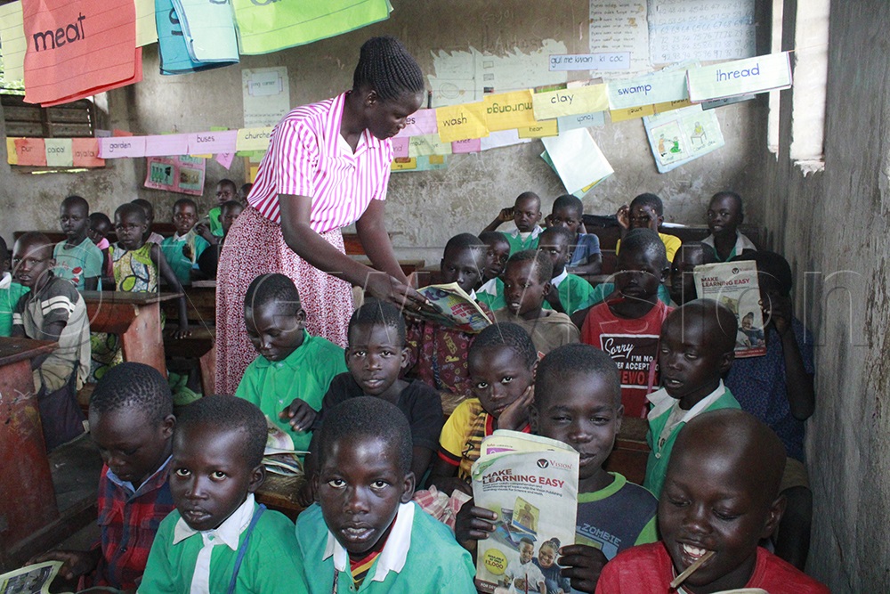Teacher Irene Acan uses Toto Magazine to teach Primary Two class. (Credit: Ritah Mukasa)