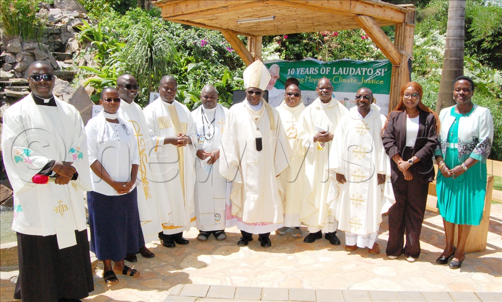 Archbishop Paul Ssemogerere (wearing a white mitre) shares a photo moment with some of the clerics and environment conservation activists who graced the celebration of the 10th anniversary of Laudato Si, at Uganda Martyrs Catholic Munyonyo, in Makindye Division on May 16 (2025).