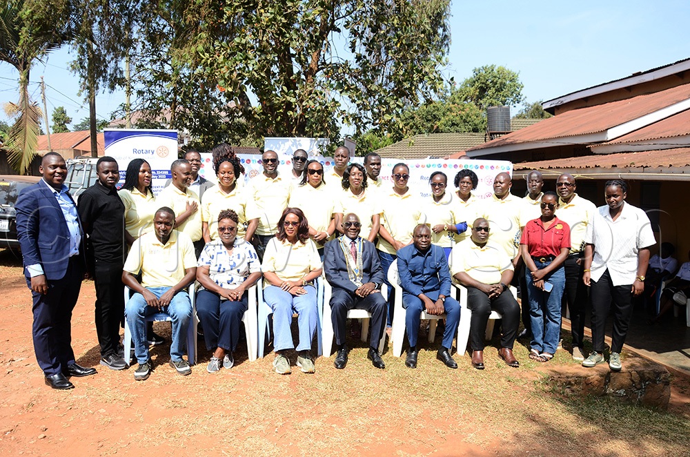 Some of the members of different Rotary Clubs pose for a group picture with Daniel Mukasa Ddamulira (seated centre), the Rotary District 9214 Governor. (Photo by Lawrence Mulondo)