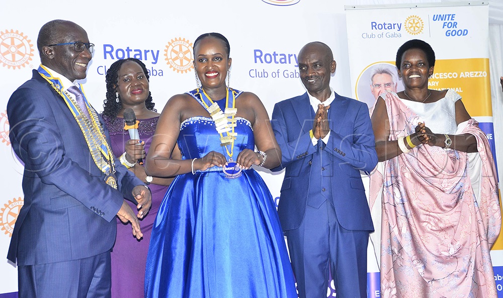 District Governor Daniel Mukasa Ddamulira (left), Rotary District 9214 (2026&ndash;2027), joins Odeth Kempogo, the 34th President of the Rotary Club of Ggaba, her parents, and Assistant Governor Mercy Nalusiba for a photo after the installation ceremony at Ggaba Parish Gardens on July 4, 2026. (Photo by Juliet Kasirye)