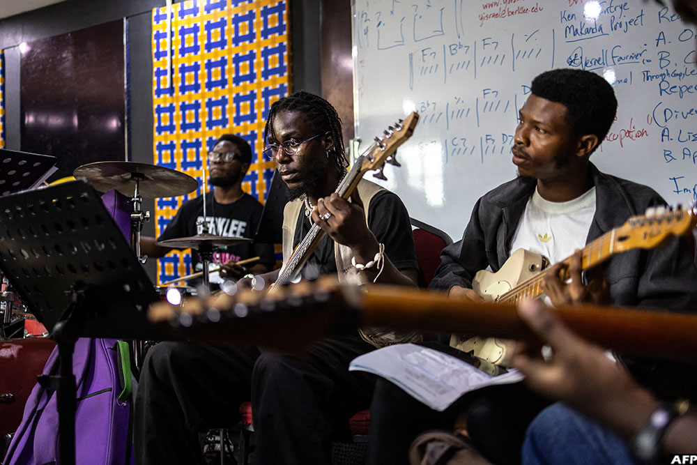 Students play guitars and drums during a session of the Tiwa Savage Music Foundation at the Muson School of Music in Lagos.(AFP)