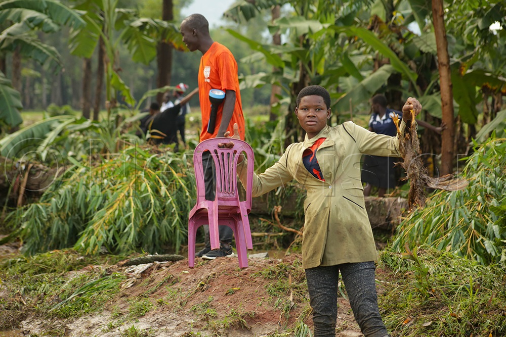 Dorothy Mutenyo recovered her baby's chair and a dead hen she had only bought days ago. (Photo by Javier Silas Omagor)