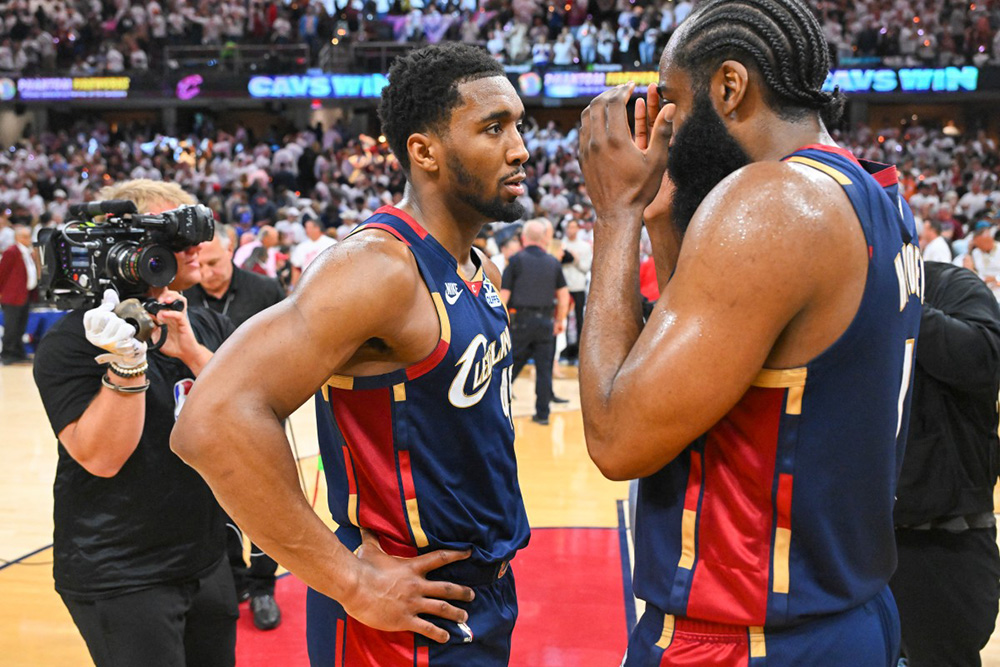 Donovan Mitchell #45 and James Harden #1 of the Cleveland Cavaliers react after their team's 116-109 win over the Detroit Pistons in Game Three of the Second Round of the NBA Eastern Conference Playoffs at Rocket Arena on May 09, 2026 in Cleveland, Ohio. (Photo by Jason Miller/Getty Images/AFP)
