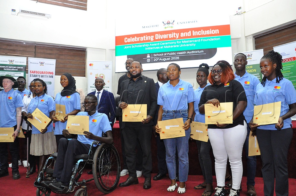 Officials and some of the students who were awarded scholarships. This was during the MasterCard Foundation award ceremony at Makerere University on August 21, 2026. (Photo by Nancy Nanyonga)